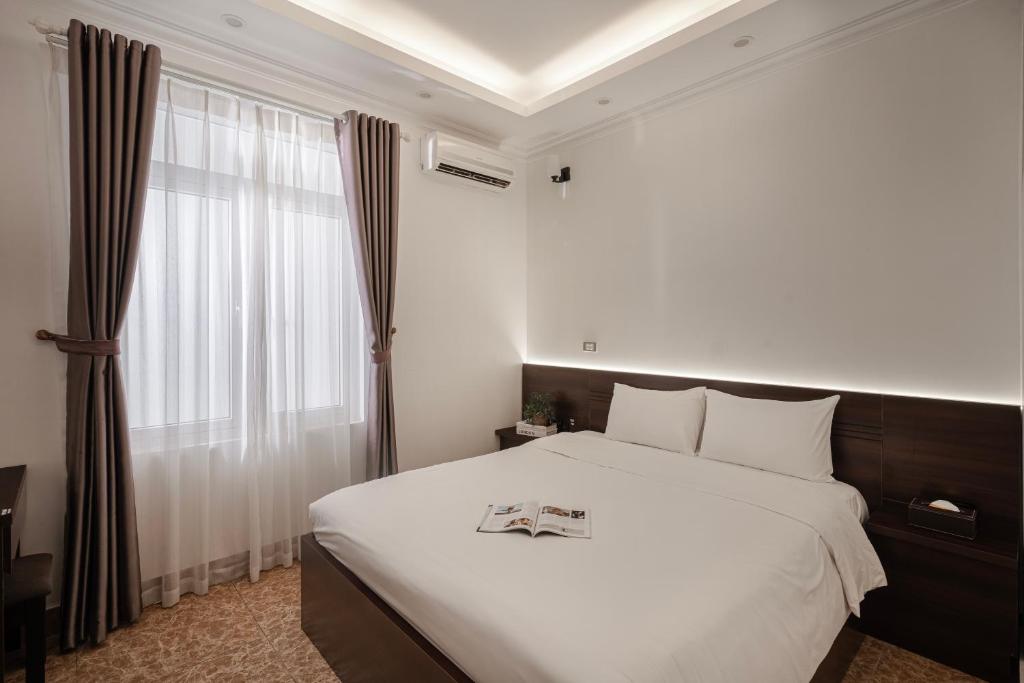 Postel nebo postele na pokoji v ubytování 그레이스 호텔 Grace Hotel & Residence