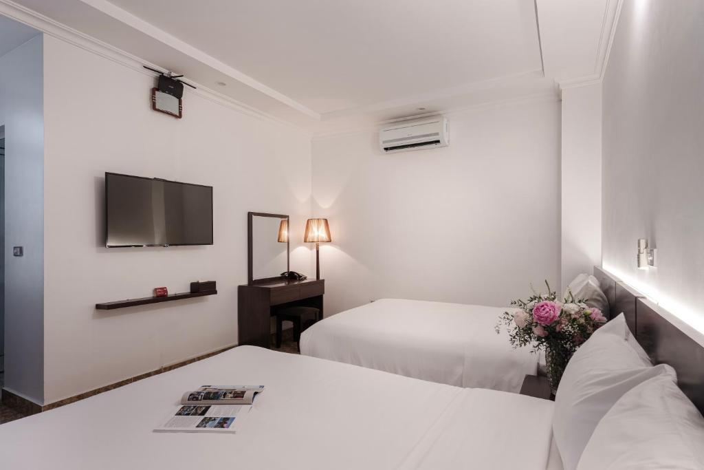 Postel nebo postele na pokoji v ubytování 그레이스 호텔 Grace Hotel & Residence