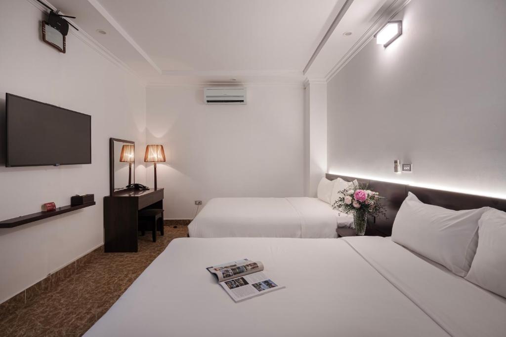 Postel nebo postele na pokoji v ubytování 그레이스 호텔 Grace Hotel & Residence