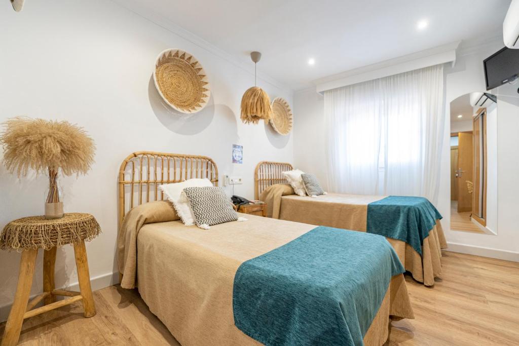 Cama o camas de una habitación en Hotel Las Américas
