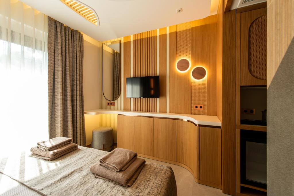 TV a/nebo společenská místnost v ubytování Casa Mimas Hotel
