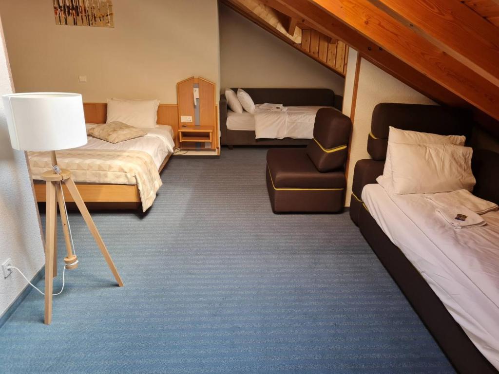 Postel nebo postele na pokoji v ubytování Hotel Bessunger Forst