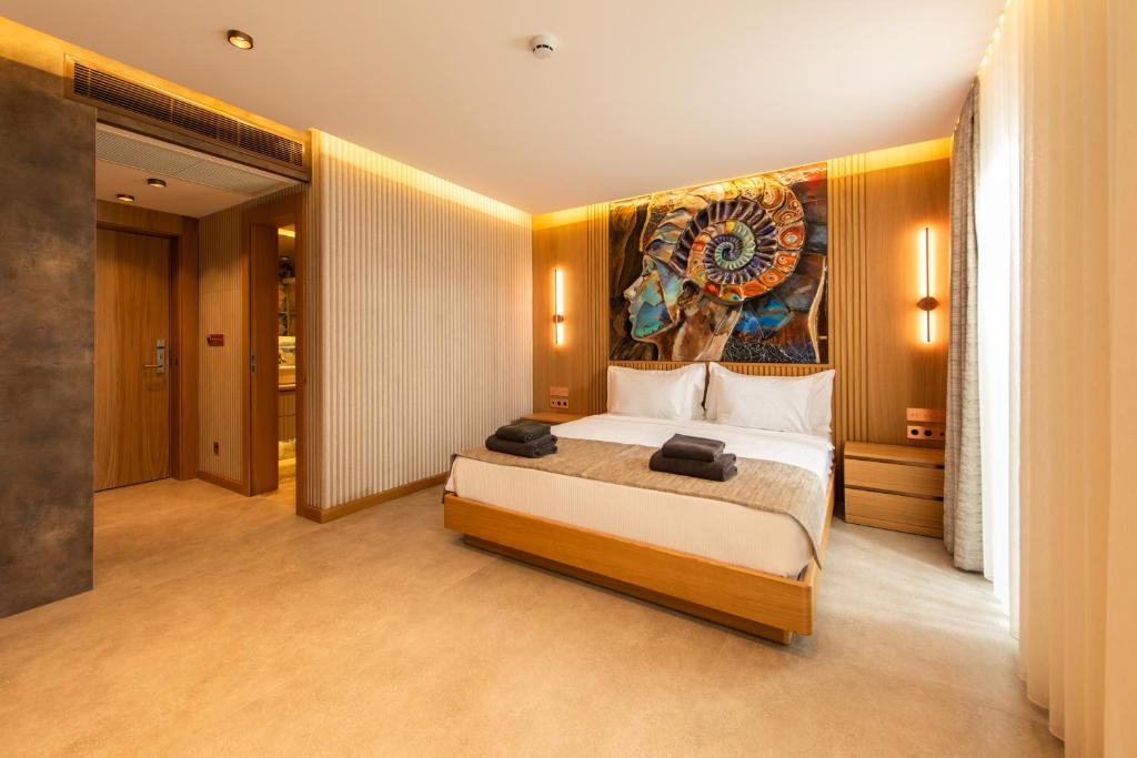 Postel nebo postele na pokoji v ubytování Casa Mimas Hotel