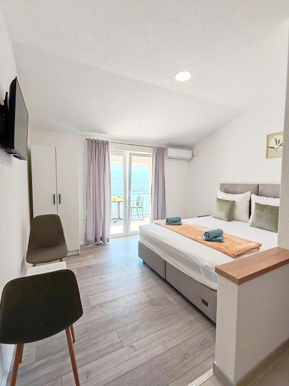 Postel nebo postele na pokoji v ubytování Apartments Kata