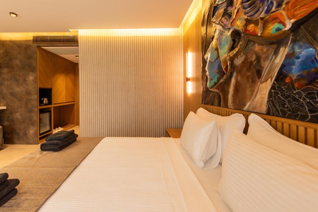 Postel nebo postele na pokoji v ubytování Casa Mimas Hotel