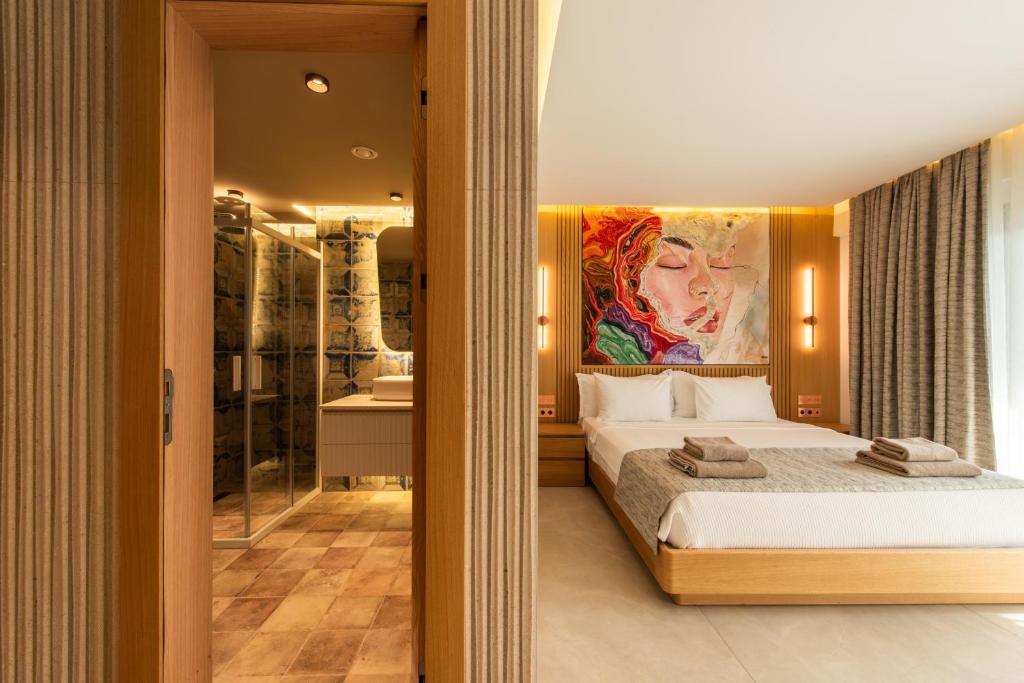 Postel nebo postele na pokoji v ubytování Casa Mimas Hotel