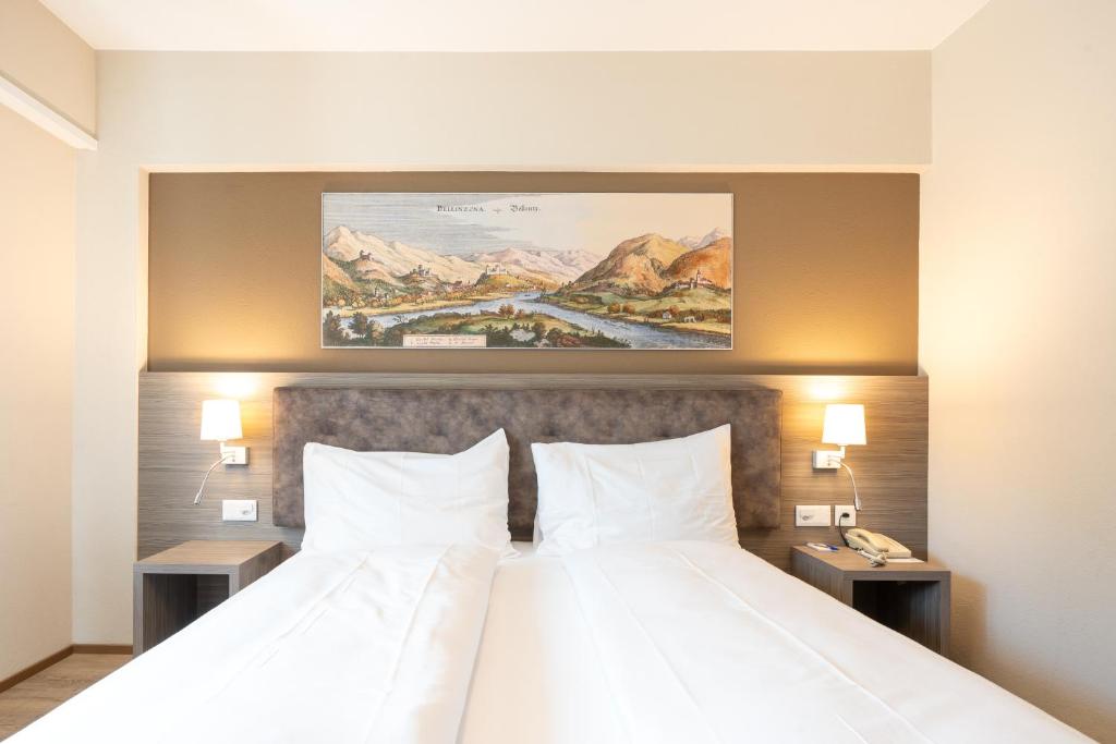 Postel nebo postele na pokoji v ubytování Hotel Unione