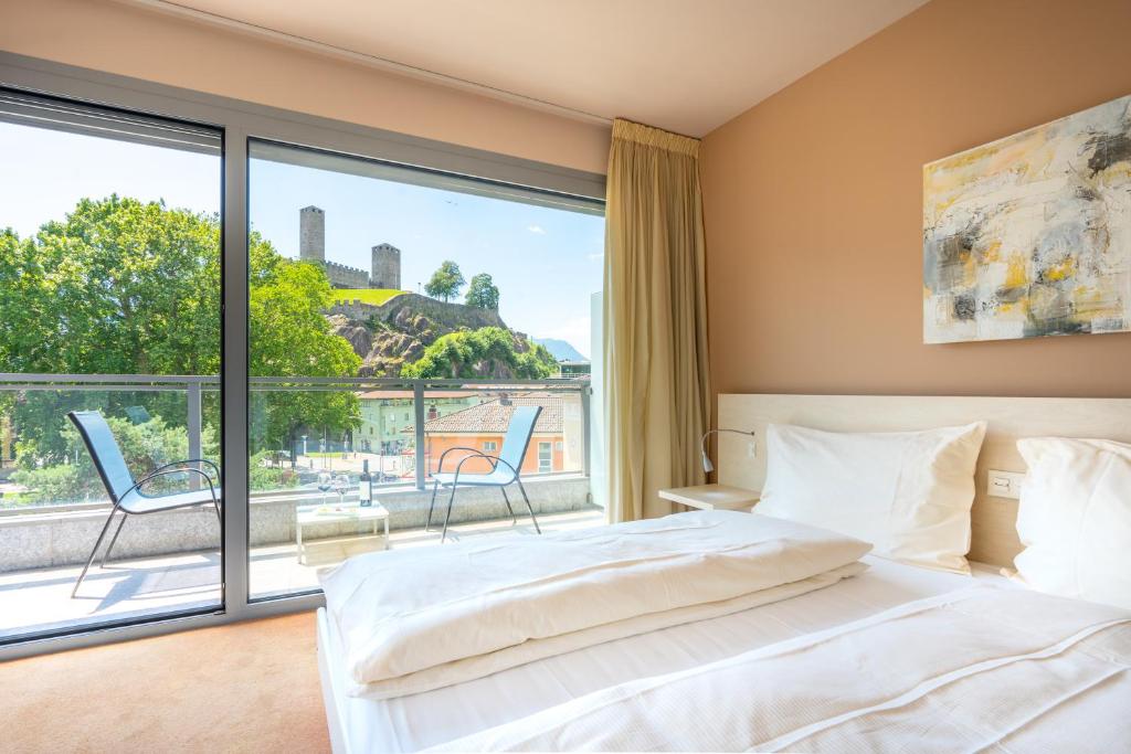 Postel nebo postele na pokoji v ubytování Hotel Unione