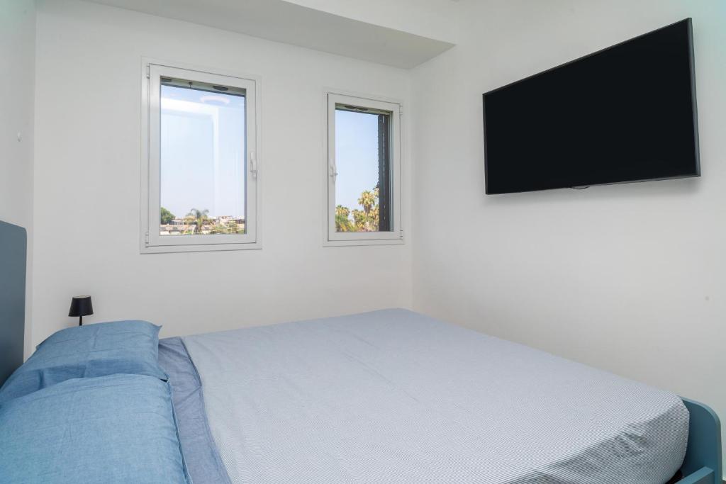 TV a/nebo společenská místnost v ubytování Etnabeach Apartament - Fondachello