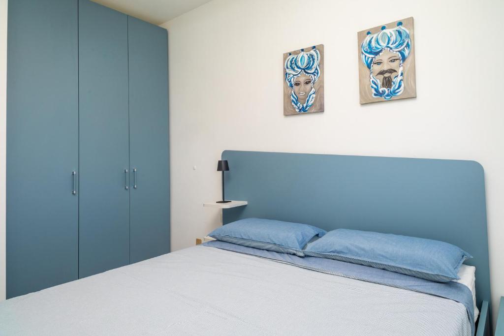 Postel nebo postele na pokoji v ubytování Etnabeach Apartament - Fondachello