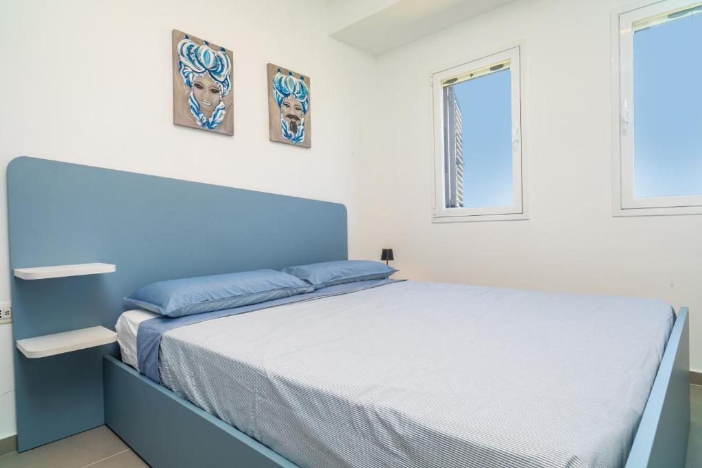 Postel nebo postele na pokoji v ubytování Etnabeach Apartament - Fondachello