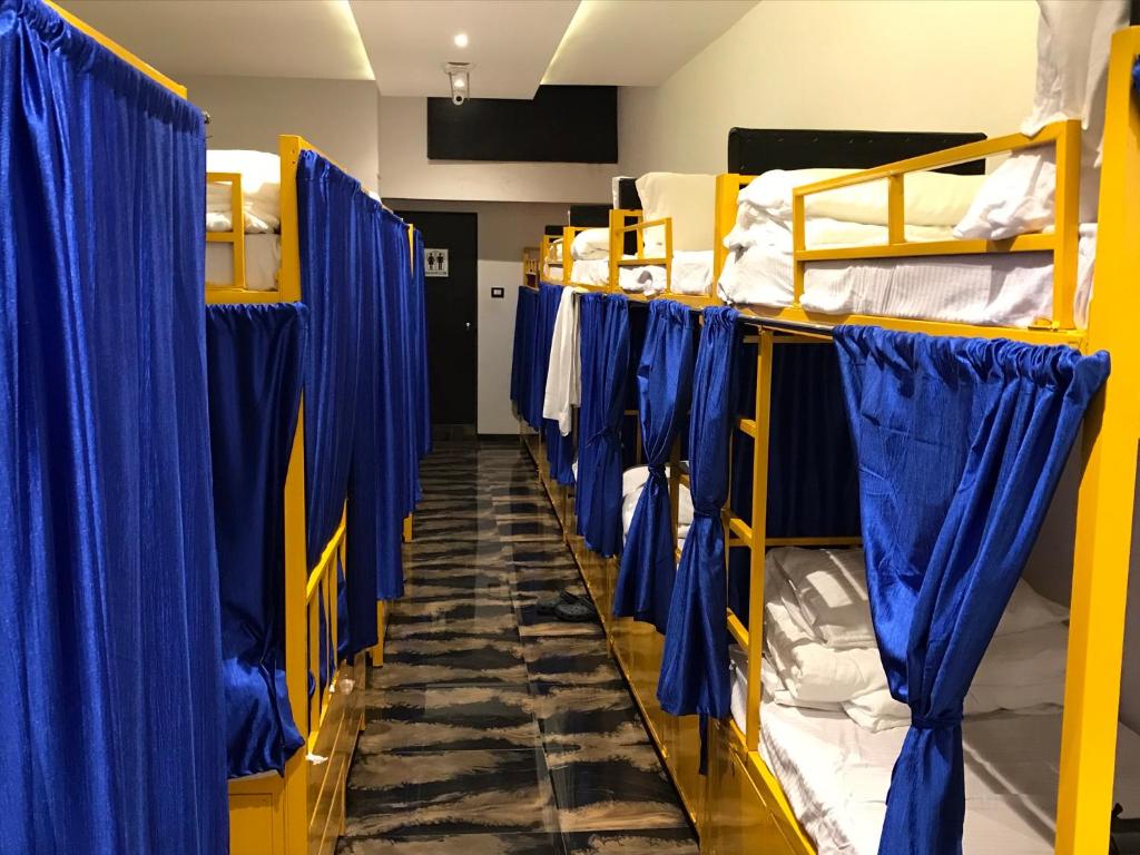 Postel nebo postele na pokoji v ubytování New Mango Dormitory