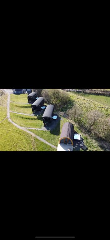 a group of buses parked in a field at Little lake lodge faceboo in Armoy