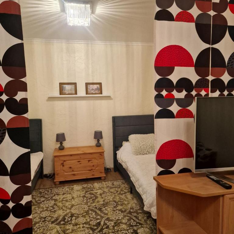 a bedroom with a bed and a tv in it at Monteurunterkunft Zesch am See in Zossen