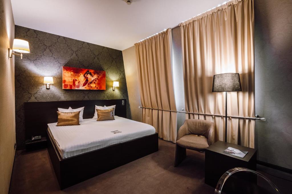 Postel nebo postele na pokoji v ubytování Plaza V Hotel