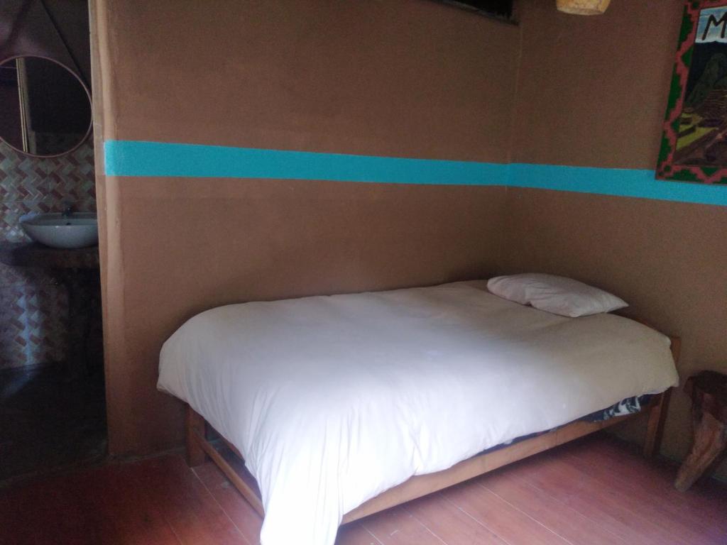 Voodi või voodid majutusasutuse Salkantay Hostel Chaullay toas