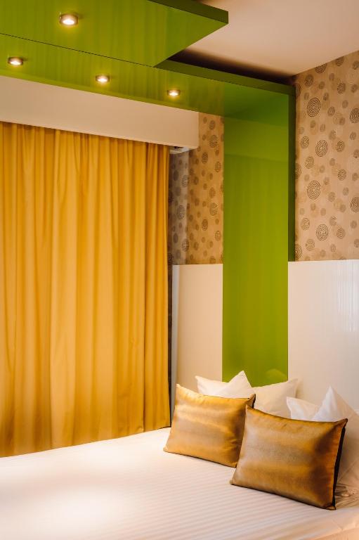 Postel nebo postele na pokoji v ubytování Plaza V Hotel