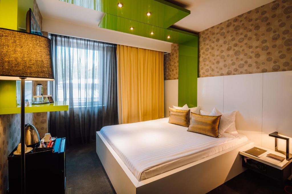 Postel nebo postele na pokoji v ubytování Plaza V Hotel