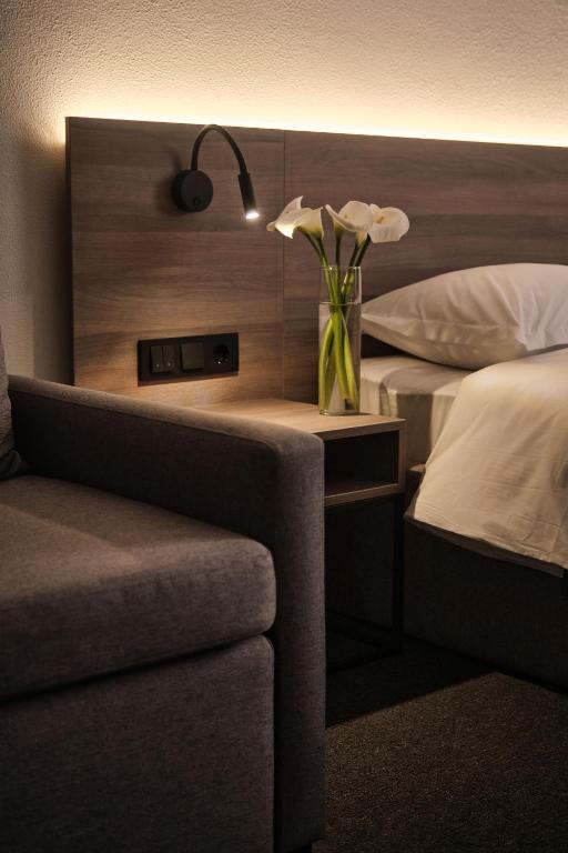 Postel nebo postele na pokoji v ubytování UNGVARSKIY Thermal Hotel