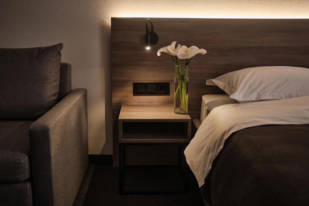 Postel nebo postele na pokoji v ubytování UNGVARSKIY Thermal Hotel