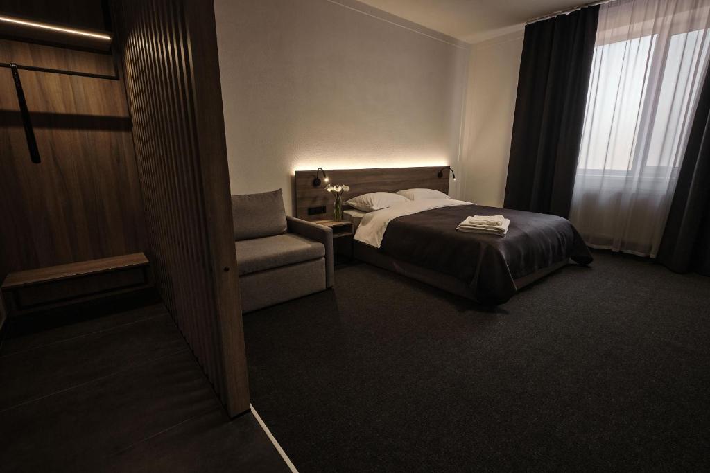 Postel nebo postele na pokoji v ubytování UNGVARSKIY Thermal Hotel