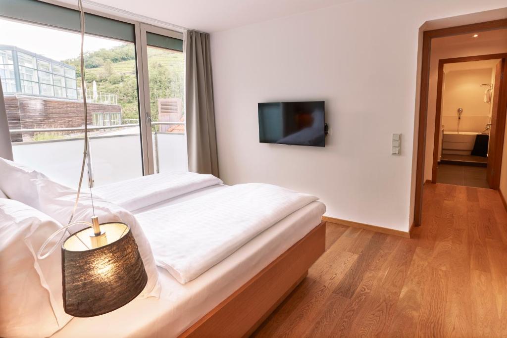 TV a/nebo společenská místnost v ubytování Steigenberger Hotel & Spa Krems