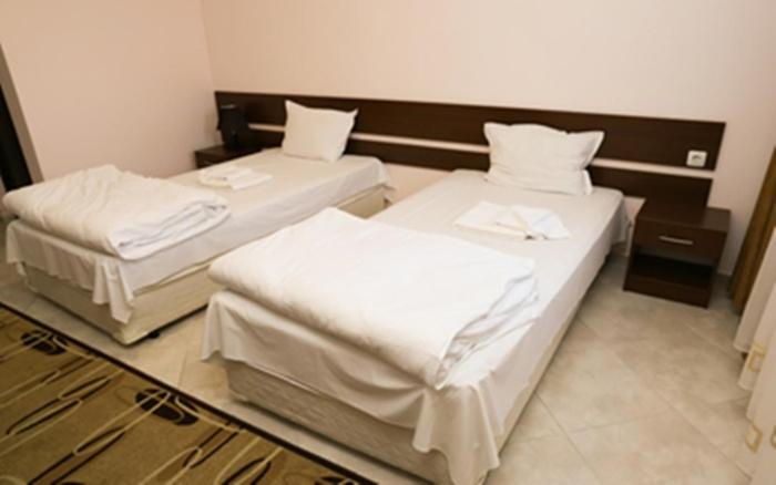 Postel nebo postele na pokoji v ubytování Hotel & Restaurant Ida