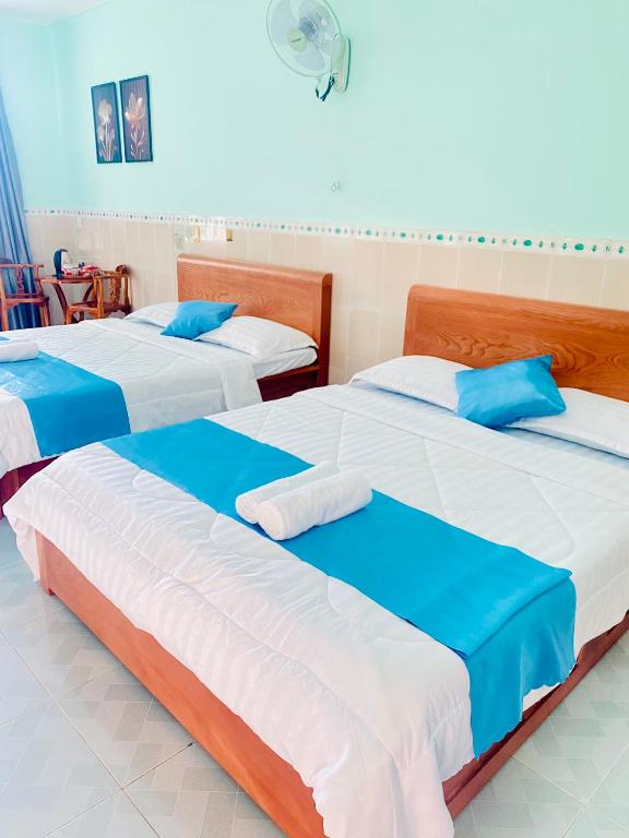 Postel nebo postele na pokoji v ubytování Phú Mỹ Port Motel