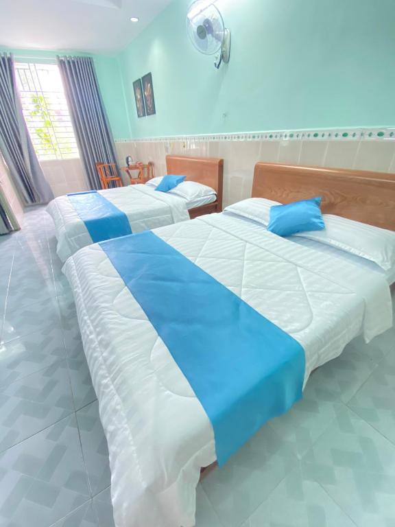 Postel nebo postele na pokoji v ubytování Phú Mỹ Port Motel