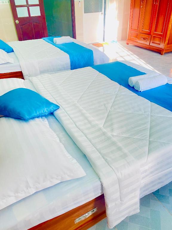 Postel nebo postele na pokoji v ubytování Phú Mỹ Port Motel
