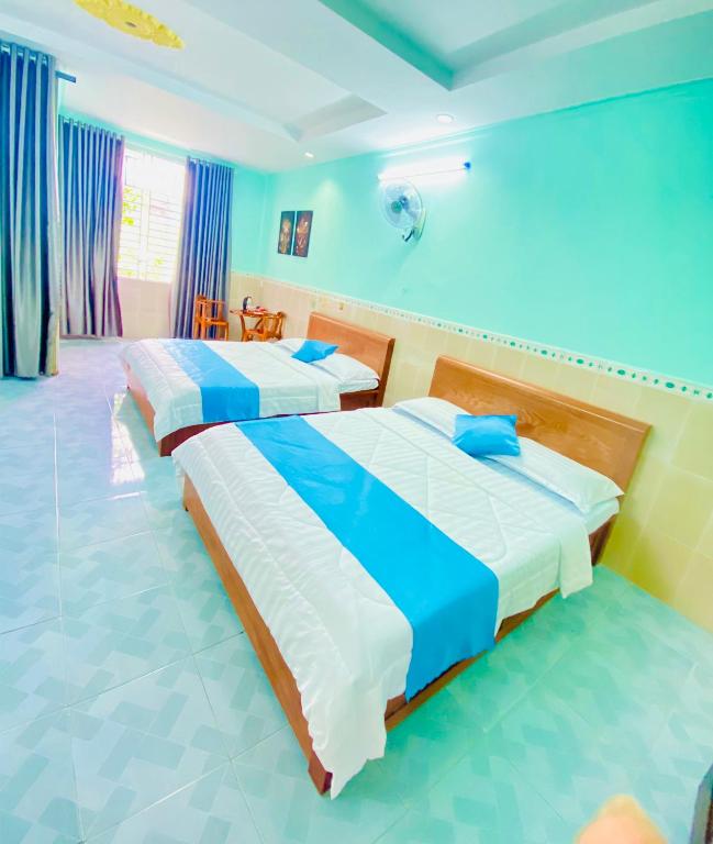Postel nebo postele na pokoji v ubytování Phú Mỹ Port Motel