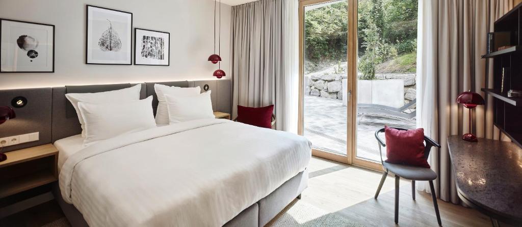 Postel nebo postele na pokoji v ubytování Steigenberger Hotel & Spa Krems