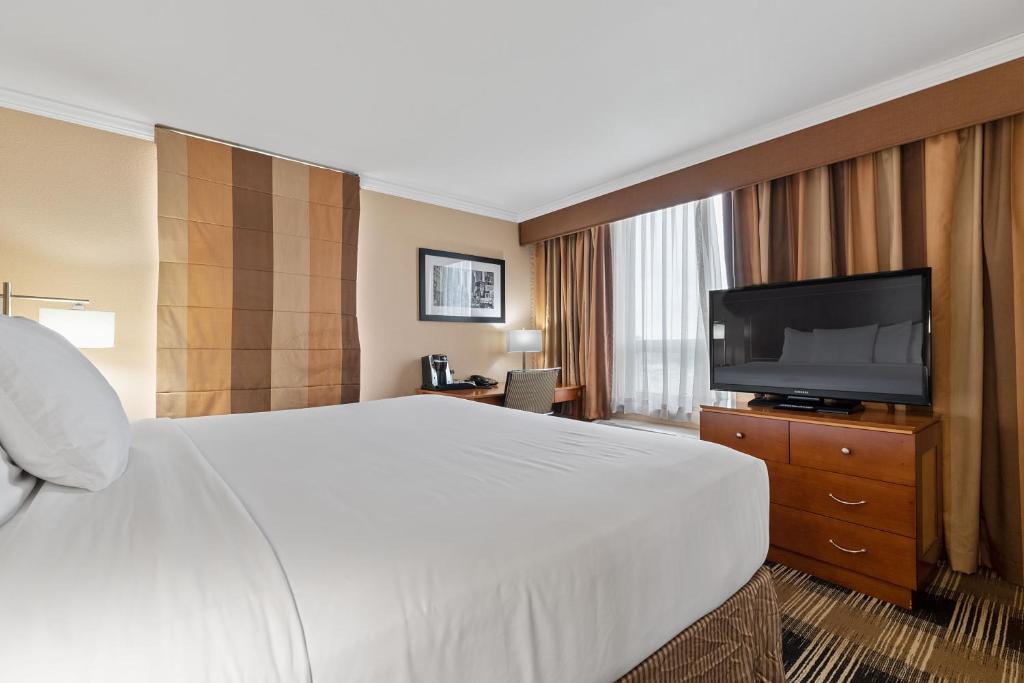 TV a/nebo společenská místnost v ubytování Hotel Executive Suites