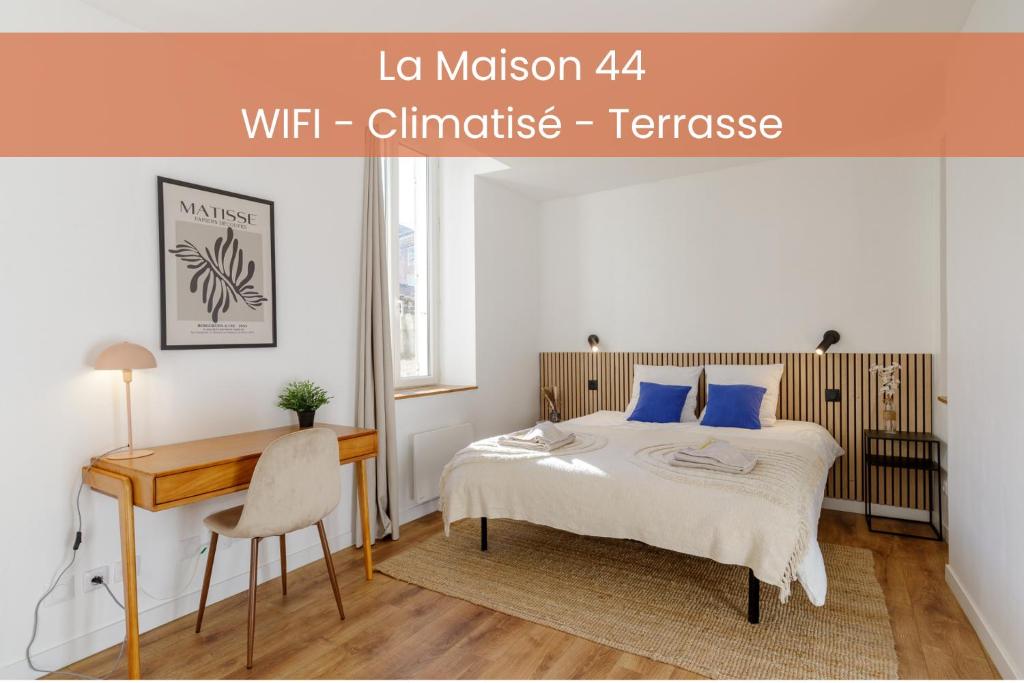 Ένα ή περισσότερα κρεβάτια σε δωμάτιο στο La Maison 44 - T2 - clim, terrasse, garage, Via Rhôna