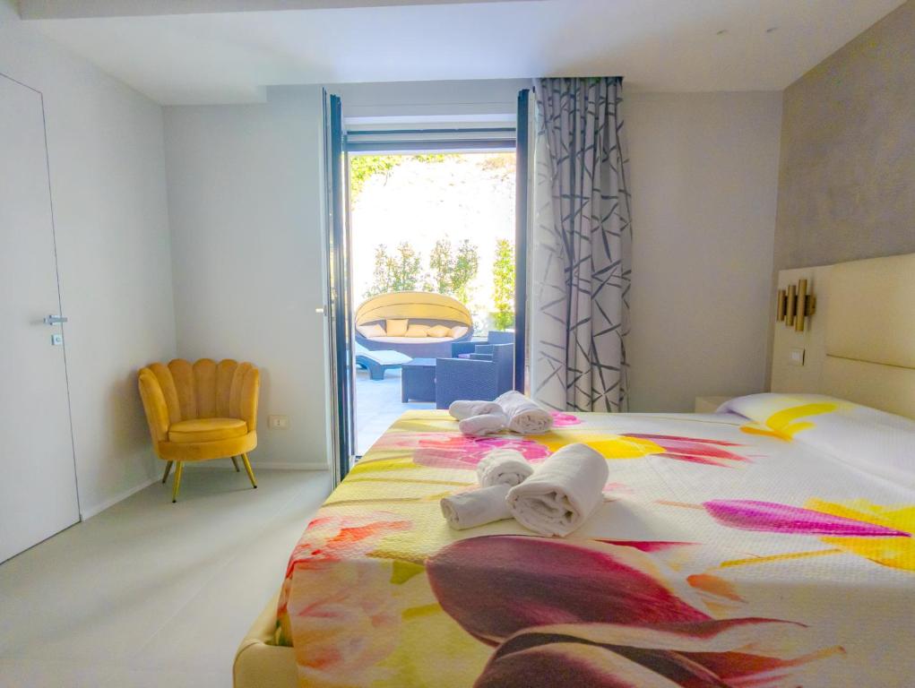 Postel nebo postele na pokoji v ubytování Residence AleDen