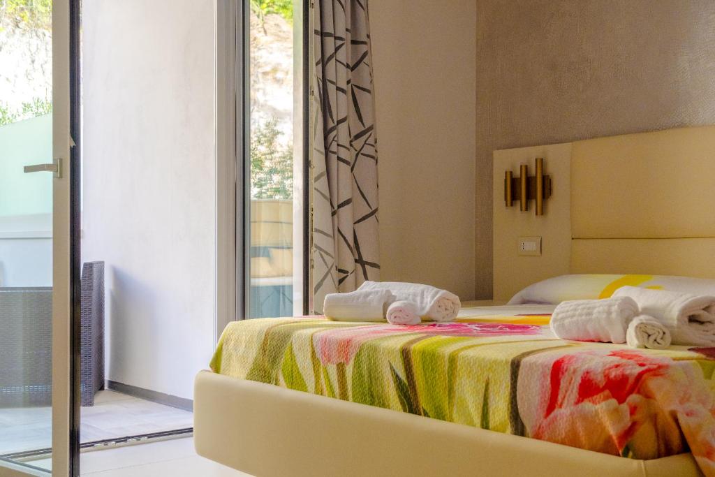 Postel nebo postele na pokoji v ubytování Residence AleDen