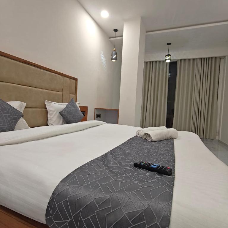 Postel nebo postele na pokoji v ubytování Hotelmaple tree