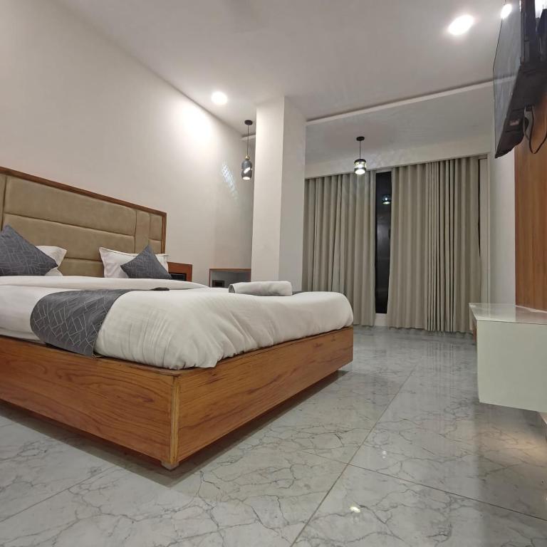 Postel nebo postele na pokoji v ubytování Hotelmaple tree