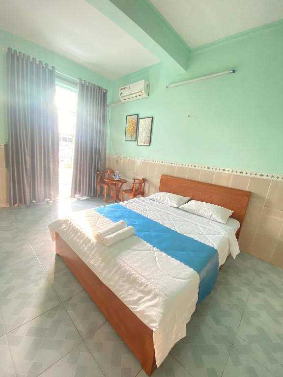 Postel nebo postele na pokoji v ubytování Phú Mỹ Port Motel