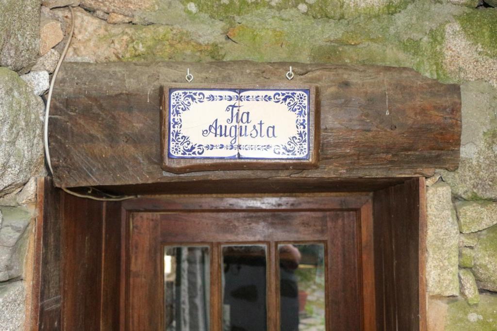 a sign above the door of a building at Casa da Tia Augusta in Castro Daire