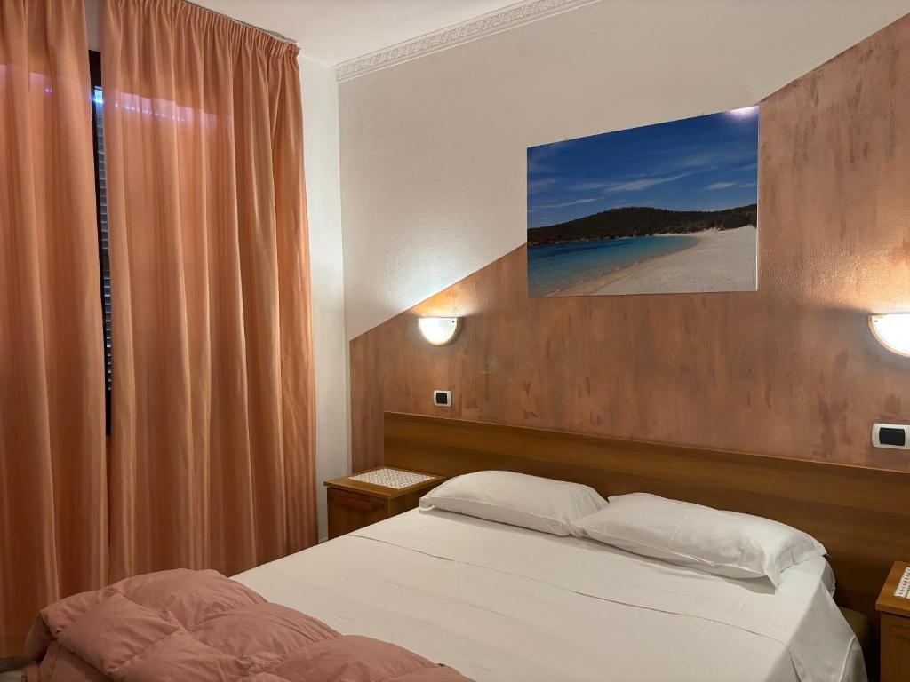 Postel nebo postele na pokoji v ubytování Sogno Sulcitano Masainas