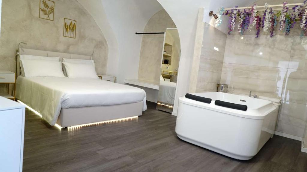 Postel nebo postele na pokoji v ubytování Luxy Gargano Suite