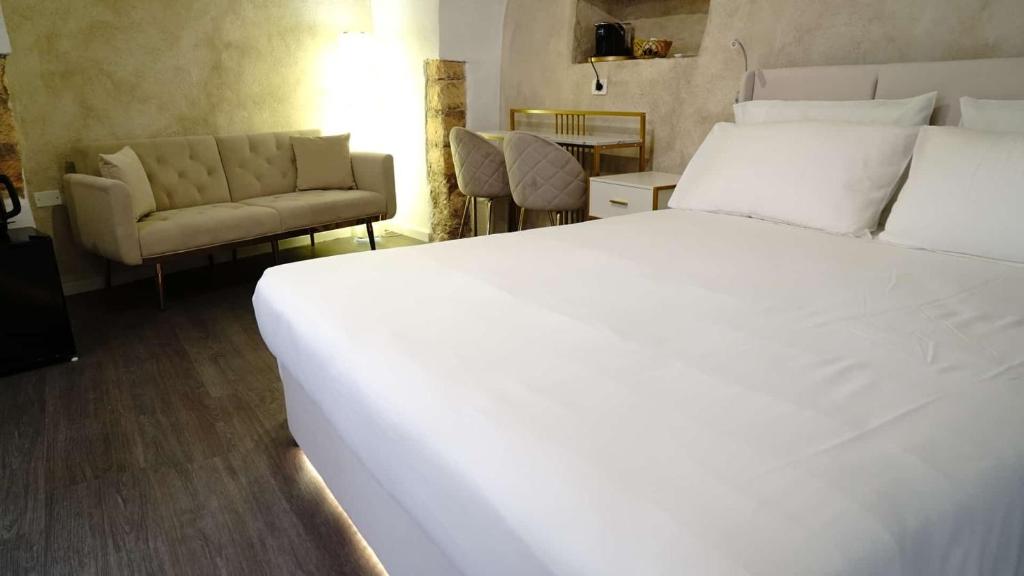 Postel nebo postele na pokoji v ubytování Luxy Gargano Suite