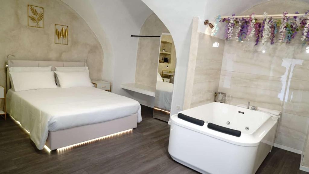 Postel nebo postele na pokoji v ubytování Luxy Gargano Suite