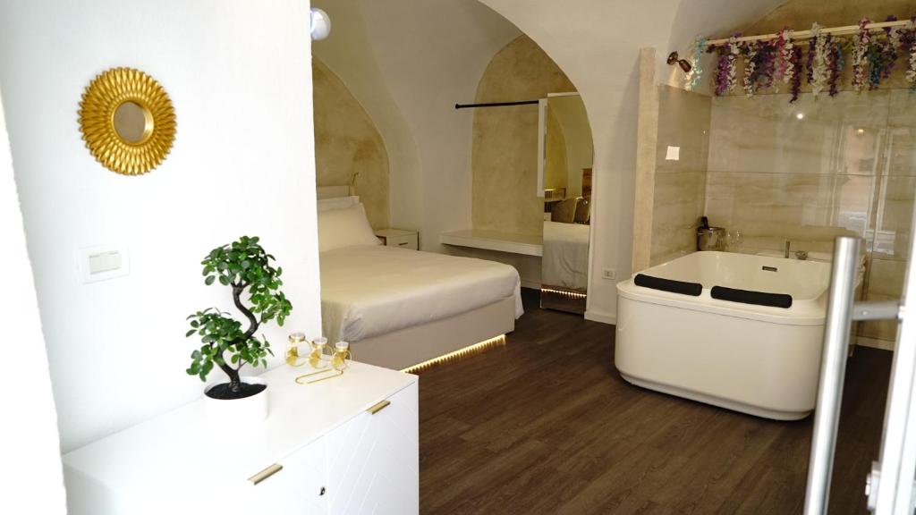 Postel nebo postele na pokoji v ubytování Luxy Gargano Suite
