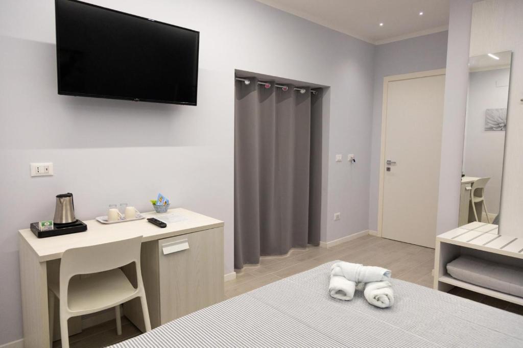 TV a/nebo společenská místnost v ubytování Pietre Azzurre Rooms
