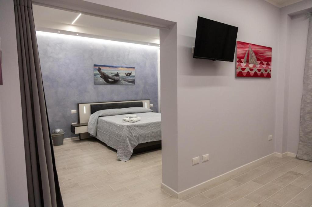 Postel nebo postele na pokoji v ubytování Pietre Azzurre Rooms