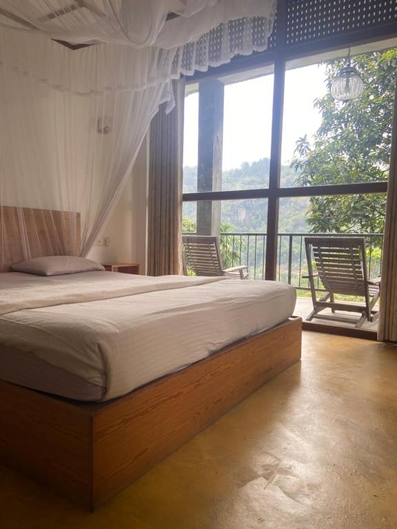Postel nebo postele na pokoji v ubytování Raveena Guest House