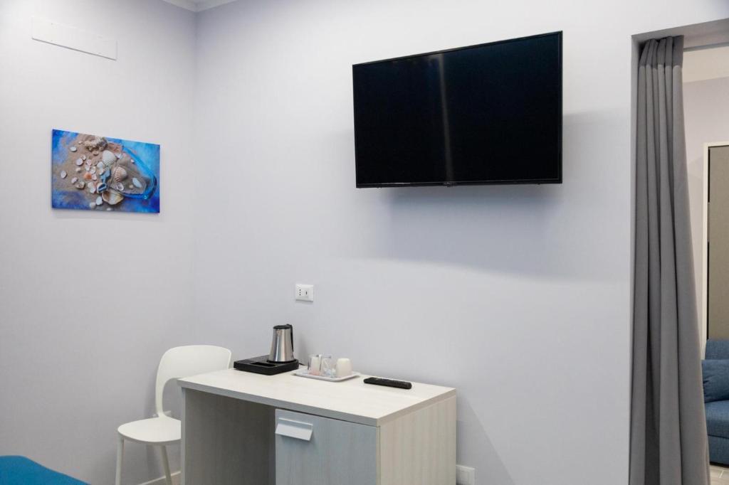 TV a/nebo společenská místnost v ubytování Pietre Azzurre Rooms