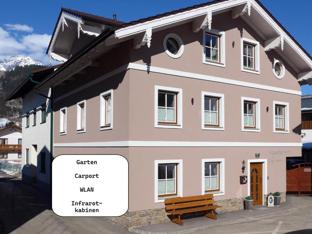 a building with a sign that says garden expert inn and therapist museum at Appartement Romana - Altstadt in Schladming